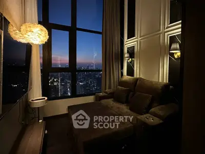 Luxurious living room with stunning city view at sunset, featuring elegant lighting and plush seating.