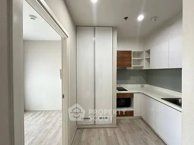 Modern kitchen with sleek cabinetry and open layout design