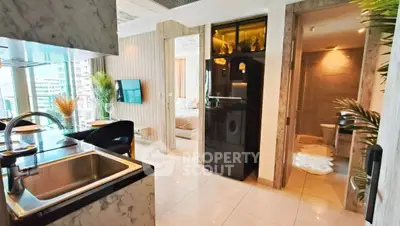 Modern apartment interior with open kitchen, cozy living area, and stylish bathroom.