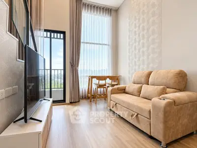 Modern living room with high ceilings, large windows, and stylish furniture in a bright apartment.