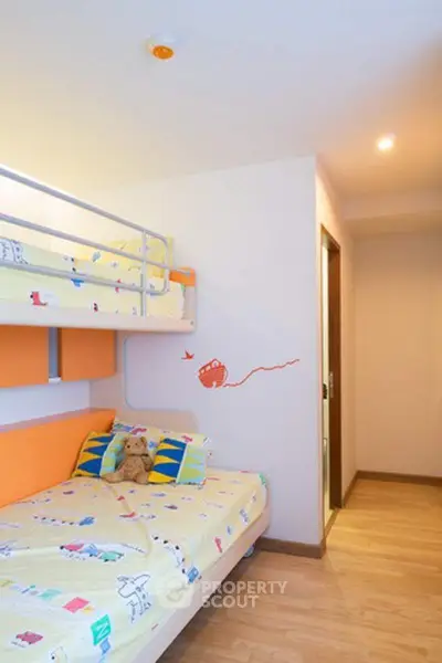 Charming children's bedroom with bunk beds and playful decor