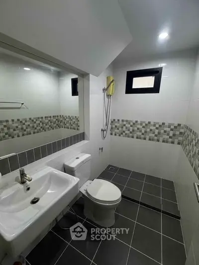 Modern bathroom with sleek tiles and contemporary fixtures