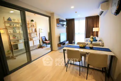 Modern living room with open layout and stylish decor, featuring a dining area and cozy seating.