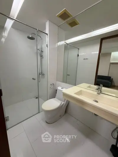 Modern bathroom with glass shower and sleek fixtures