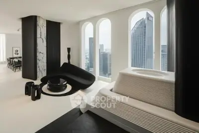 Luxurious modern living room with panoramic city views and sleek black and white decor
