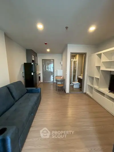 Modern studio apartment with open layout and sleek furnishings