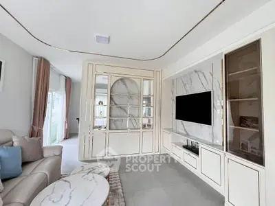 Luxurious living room with elegant marble accents and modern entertainment center