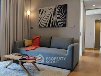 Stylish living room with modern sofa and zebra artwork, perfect for relaxation.
