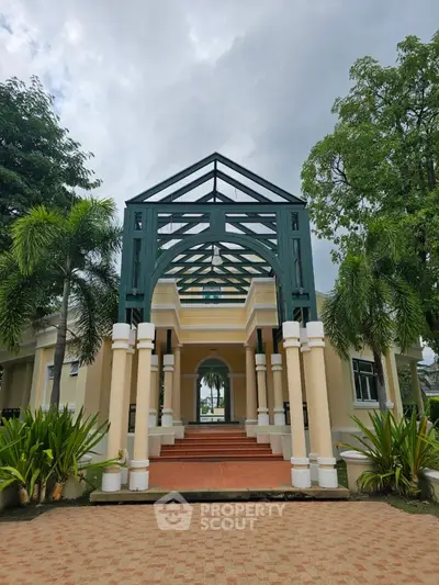 Stunning architectural entrance with lush greenery and elegant design