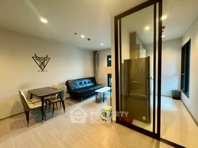 Modern living room with glass partition and stylish furniture