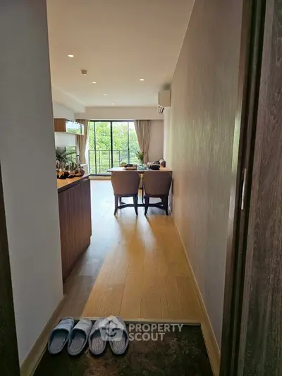 Stylish open-layout living room with balcony view and modern decor