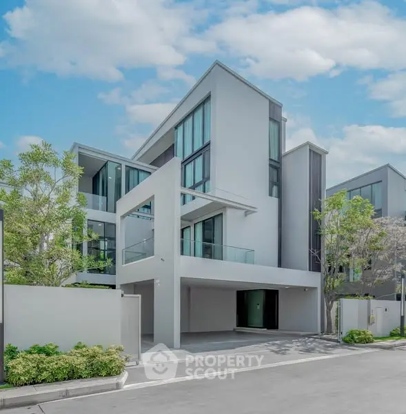 Modern architectural design of a luxury residential building with sleek lines and large windows.