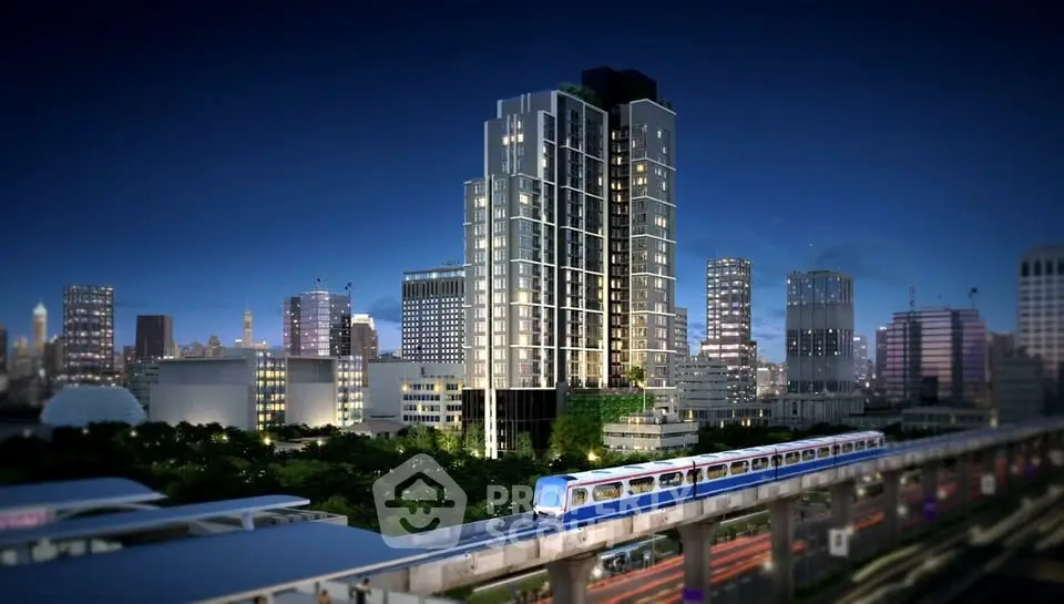 Stunning night view of modern high-rise building with city skyline and train in foreground.