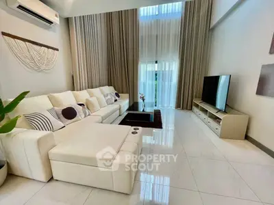 Spacious modern living room with high ceilings and elegant decor