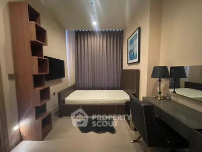 Modern bedroom with stylish furniture and cozy ambiance, featuring a sleek desk and elegant lighting.