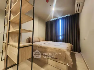 Modern bedroom with stylish shelving and cozy bed in contemporary apartment