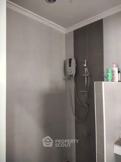 Modern bathroom with sleek shower and neutral tiles