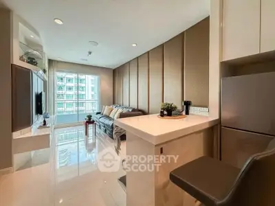 Modern living room with sleek design and natural light in a high-rise apartment.