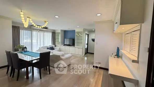 Spacious modern living room with elegant dining area and natural light