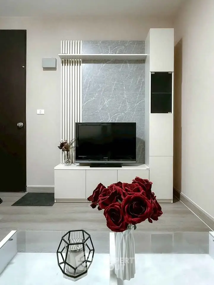 Modern living room with sleek TV unit and elegant decor