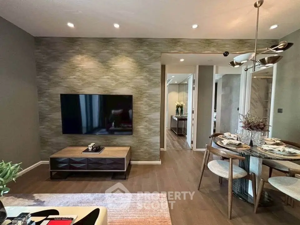 Modern living room with stylish dining area and wall-mounted TV