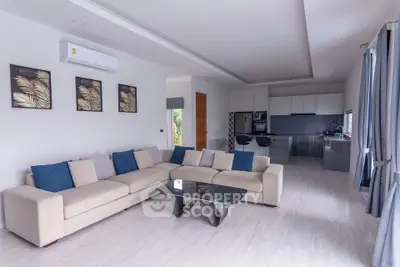 Spacious modern living room with open kitchen and stylish decor