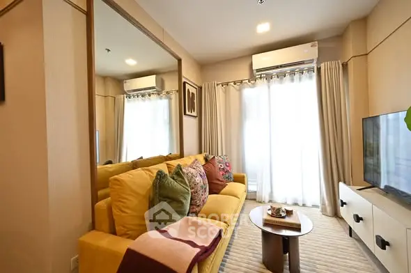 Stylish living room with yellow sofa and modern decor in cozy apartment.