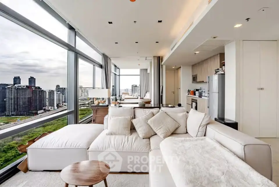 Luxurious corner unit with panoramic city views and spacious open living area.
