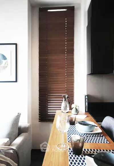 Stylish modern kitchen with wooden blinds and elegant dining setup