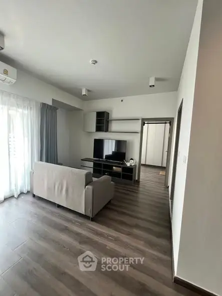 Modern living room with sleek furniture and natural light