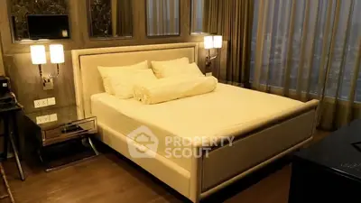 Luxurious bedroom with elegant decor and ambient lighting in a modern apartment.