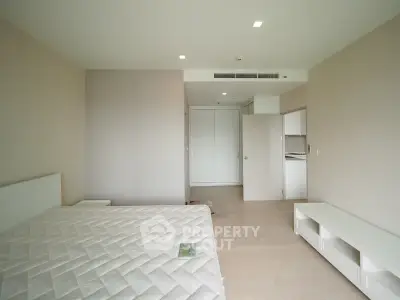 Spacious bedroom with minimalist design and natural light