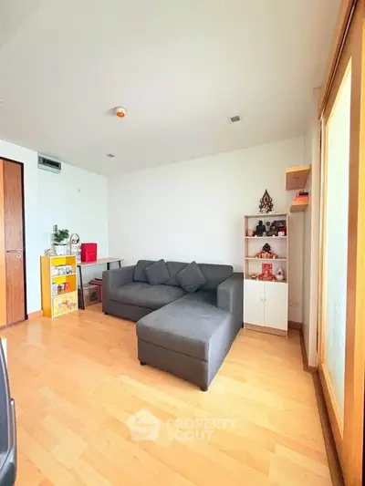 Cozy living room with modern sofa and wooden flooring