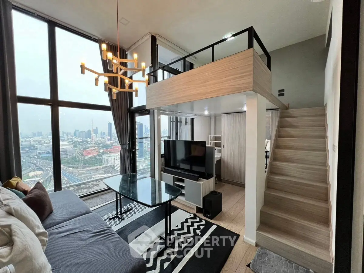 Modern loft-style living room with large windows and city view