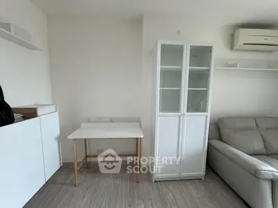 Modern minimalist living room with sleek furniture and air conditioning