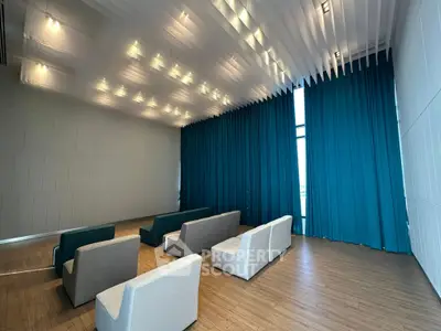 Spacious modern lounge with elegant seating and floor-to-ceiling windows
