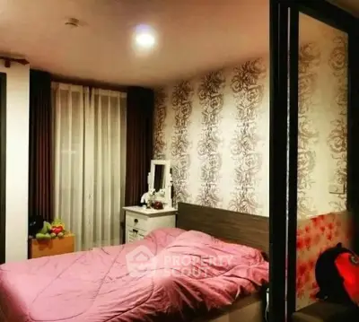 Cozy bedroom with elegant wallpaper and soft lighting, perfect for relaxation.
