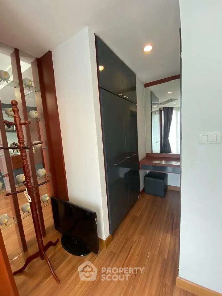 Stylish interior with wooden flooring and modern furniture in a cozy apartment corner.