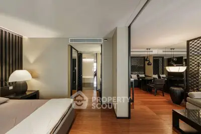 Luxurious modern apartment interior with elegant bedroom and spacious living area, featuring stylish decor and warm lighting.