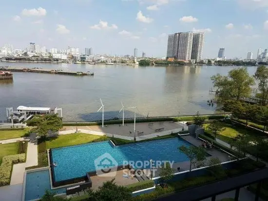 Stunning riverside view with pool and cityscape, perfect for luxury living.