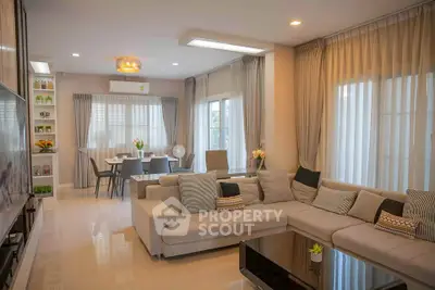 Spacious modern living room with elegant decor and large windows