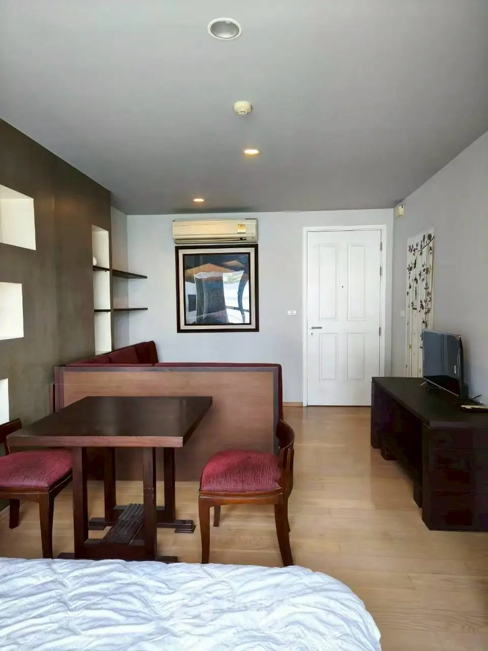 Modern studio apartment with cozy dining area and stylish decor