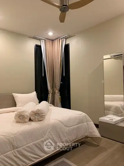 Cozy bedroom with elegant decor and modern ceiling fan