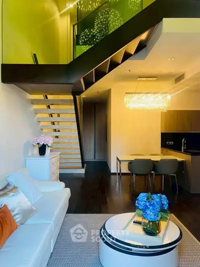 Luxurious modern living room with elegant staircase and chic decor