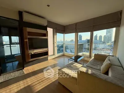 Modern living room with panoramic city view and cozy seating area