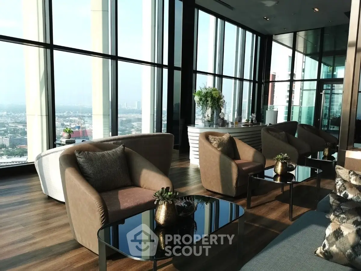 Luxurious high-rise living room with panoramic city views and elegant modern furnishings.