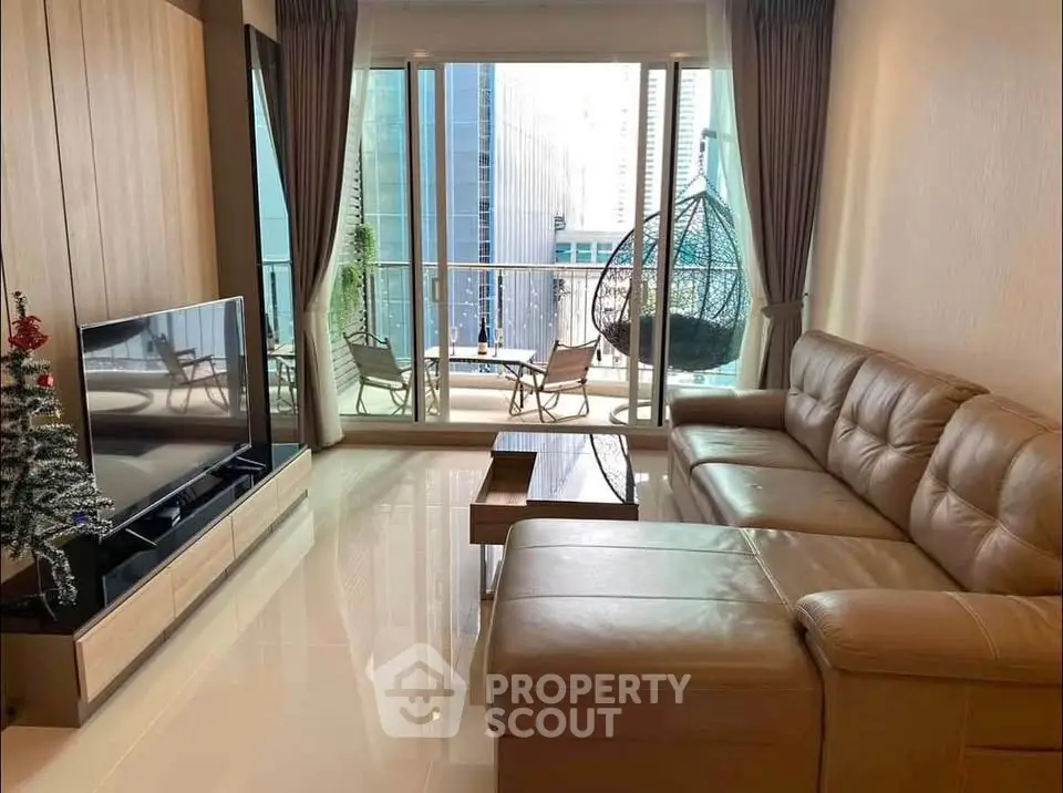 Luxurious living room with leather sofa and city view balcony in modern apartment.