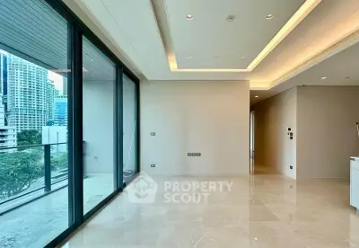 Spacious modern living room with large windows and city view balcony.