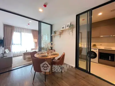 Modern open-plan living and dining area with elegant decor and natural light.