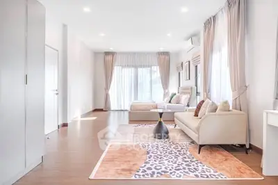 Spacious and elegant bedroom with modern decor and natural light